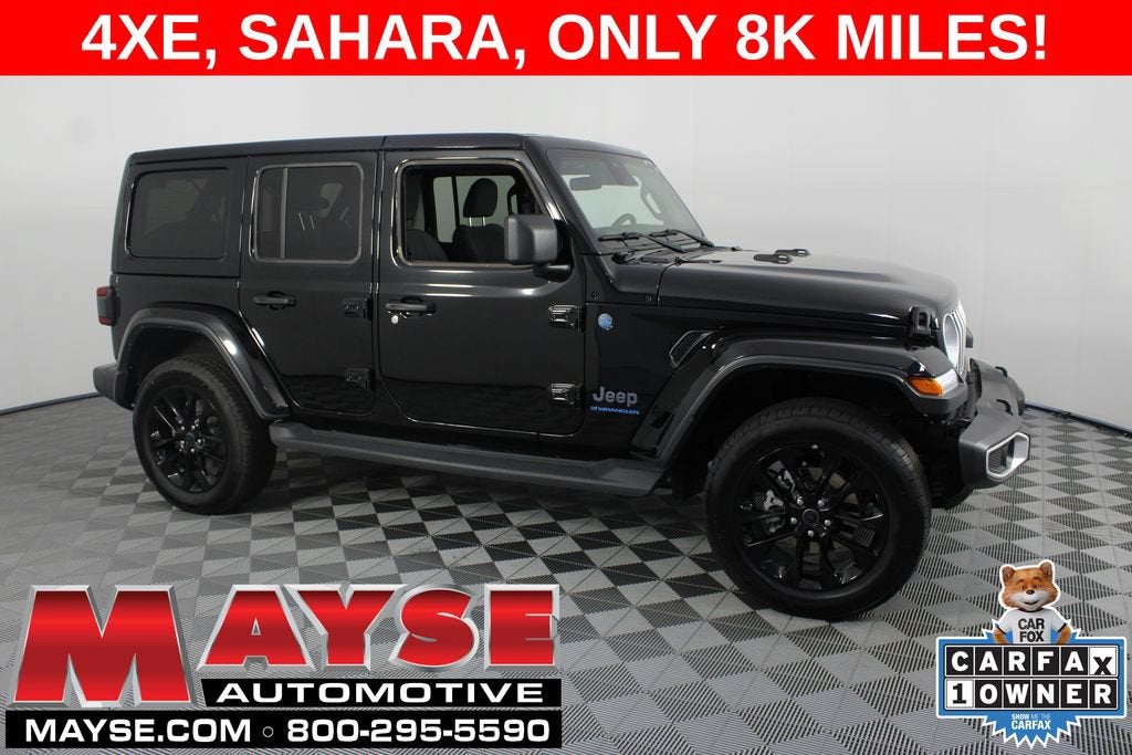 2025 Jeep Wrangler 4xe Sahara in Black/Sahara/4X — front three-quarter view
