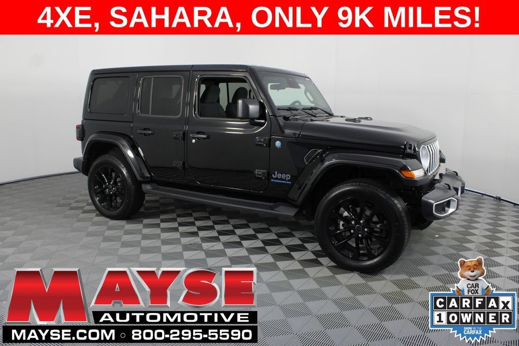 2025 Jeep Wrangler 4xe Sahara in Black/Sahara/4X — front three-quarter view